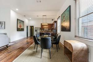 a dining room and living room with a table and chairs at 5Bed StreetCar Retreat w Outdoor Entertaining in New Orleans