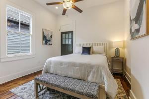 a bedroom with a bed and a ceiling fan at 5Bed StreetCar Retreat w Outdoor Entertaining in New Orleans