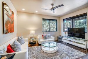 a living room with a couch and a tv at Modern Sedona Guesthouse with Patio, Walk to Trails! in Sedona