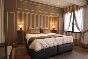 Cama o camas de una habitación en La Cense - Ferme des Tilleuls
