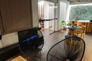 a living room with two chairs and a table at Hotel Black Tower Premium in Bogotá