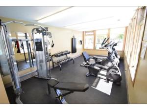 a gym with two tread machines and a treadmill at Cozy Mountain I Hot Tub & Pool I Close 2 Lake I TV in Invermere