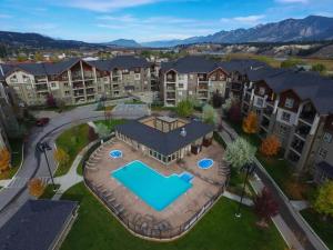 an aerial view of an apartment complex with a swimming pool at Cozy Mountain I Hot Tub & Pool I Close 2 Lake I TV in Invermere