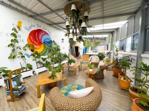 a room filled with lots of potted plants at Hotel Bolivariana Plaza Medellin in Medellín