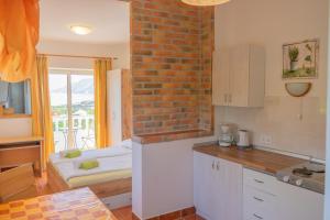 Kuchyň nebo kuchyňský kout v ubytování Apartements Magdalena