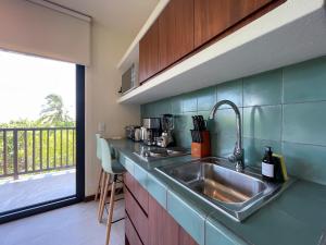 Kuchyň nebo kuchyňský kout v ubytování Ocean View Loft in Punta Cocos - C102