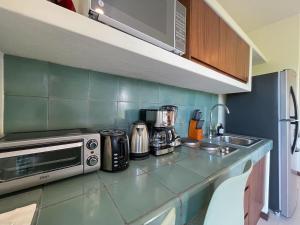 Kuchyň nebo kuchyňský kout v ubytování Ocean View Loft in Punta Cocos - C102