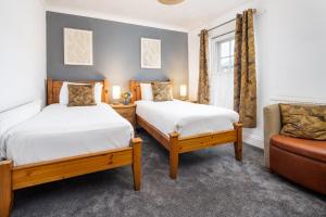 En eller flere senge i et værelse på Boars Head Hotel
