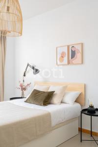 Postel nebo postele na pokoji v ubytování Koti Rentals - Nenúfar