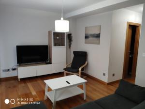 A television and/or entertainment centre at Coco Pardal, Pontevedra