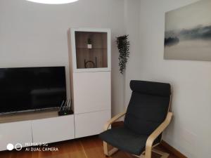 A television and/or entertainment centre at Coco Pardal, Pontevedra