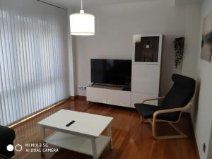 A television and/or entertainment centre at Coco Pardal, Pontevedra