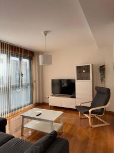 A television and/or entertainment centre at Coco Pardal, Pontevedra