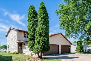 a large tree in front of a house at Relax on Ridgeview- 3 bedroom in Appleton