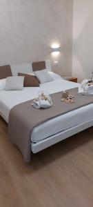Ένα ή περισσότερα κρεβάτια σε δωμάτιο στο MariGarda Apartments