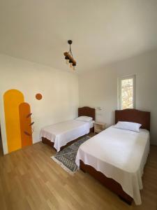 Кровать или кровати в номере Yedi Butik Hotel