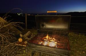 a grill with a pan on top of it at Trossos Del Priorat in Gratallops