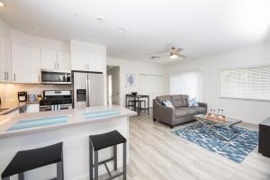 a kitchen and living room with a couch and a table at Sonoma Grove Suites in Sonoma +17 photos