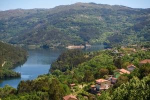 a view of a river and a village in a valley at CASA RIGOR in Rio Caldo