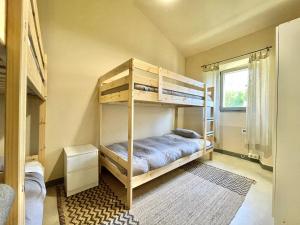 a bedroom with bunk beds and a window at La Casa da Pipa in Cesuras +60 photos