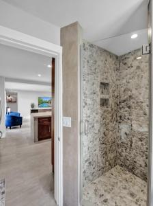 a bathroom with a walk in shower in a room at Windward Escape in Fort Lauderdale