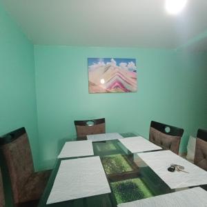 a dining room with a table and chairs at Pablin in Trujillo