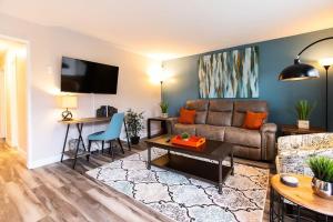 a living room with a couch and a table at NorthPark-Professionals-Restaurants-King-Park-WiFi in San Diego