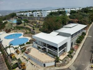 an aerial view of a building with a swimming pool at Girardot Deluxe in Girardot