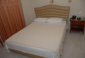 Postel nebo postele na pokoji v ubytování Hotel Ilida