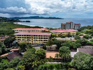 an aerial view of a resort and the ocean at Remodeled Top-Floor Flamingo Condo with Outstanding Ocean Views in Playa Flamingo