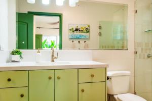 a bathroom with a sink and a toilet and a mirror at 1-BD Near Beach Great for Digital Nomads in Potrero +21 photos