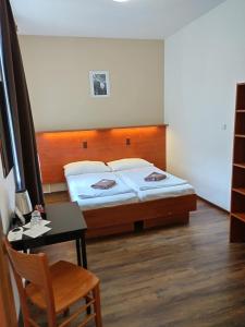Postel nebo postele na pokoji v ubytování Beta Pension