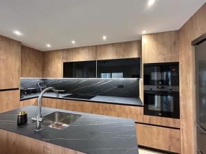 a kitchen with a sink and a stove at Stunning groundfloor apartment - MO2802LT in Los Tomases