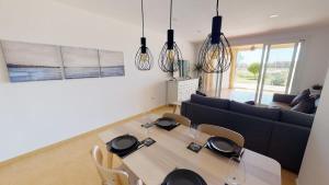 a living room with a table and a couch at Spacious ground floor apartment - EO2402MM in Torre-Pacheco