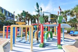 un parque infantil con equipo colorido en Pool View Oceanfront Caravelle Resort w Lazy River, en Myrtle Beach