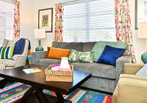 a living room with a couch and a table at Mai Taid Beach House 1 Minute Walk to Beach in Myrtle Beach