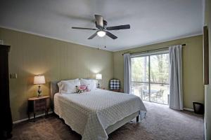 a bedroom with a bed and a ceiling fan at 4 Bedroom 2 Bath Retreat in Jackson with Great Backyard in Jackson