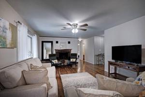 a living room with a couch and a flat screen tv at 4 Bedroom 2 Bath Retreat in Jackson with Great Backyard in Jackson