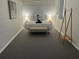 Ένα ή περισσότερα κρεβάτια σε δωμάτιο στο The Gallipoli Flat