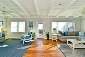 a living room with a couch and a table at Hazels Castle Huge 2 in 1 Oceanfront House near Pier in Myrtle Beach