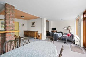 a living room with a table and a couch at Hello Zeeland - Vakantiehuis Weststraat 13A in Domburg