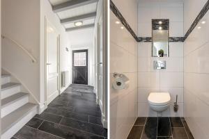 a bathroom with a toilet and a staircase at De Grote Schuur at Buitenplaats Zeeuwse Liefde in Westkapelle