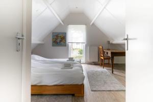 Ένα ή περισσότερα κρεβάτια σε δωμάτιο στο Hello Zeeland - Schelpweg 16A