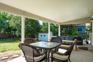 a patio with a table and chairs and a couch at Denver Family Retreat 4BR 3 BA - Large Backyard in Arvada
