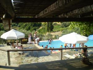 a group of people in a swimming pool at Vateri in Limne