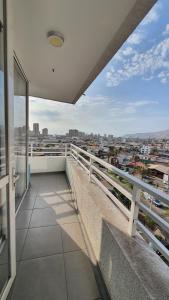 a balcony with a view of a city at Edificio One in Iquique