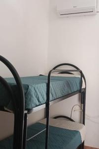 Ένα ή περισσότερα κρεβάτια σε δωμάτιο στο Casa Vacanze Sole +3 φωτογραφίες