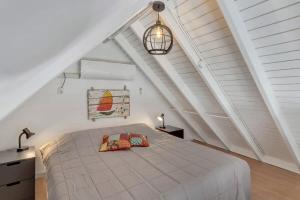 a bedroom with a large bed in a attic at Caribbean Court Studio 321 in Kralendijk +19 photos