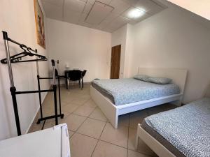 Posteľ alebo postele v izbe v ubytovaní Apartamenty Gołębia-Economic