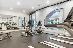 a gym with treadmills and elliptical machines at MA-a 1118 in Melbourne